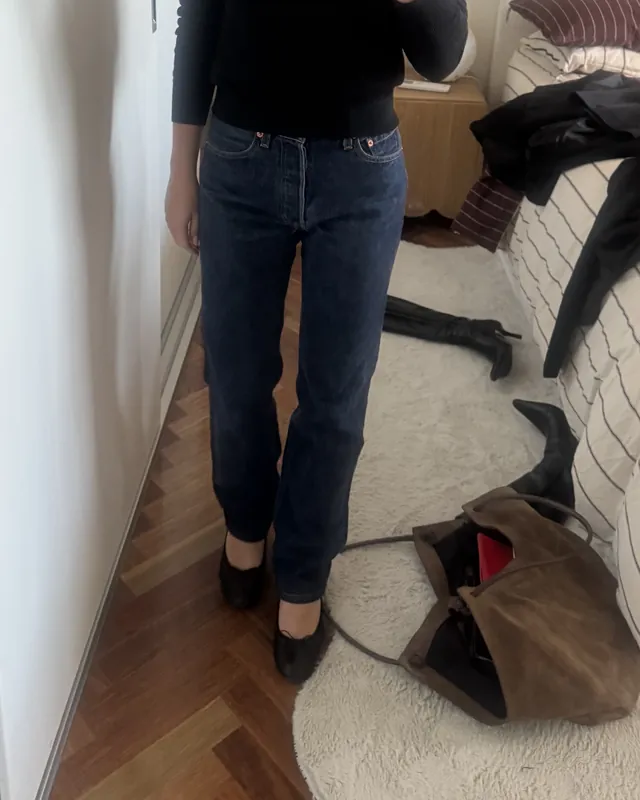 Vintage Levi’s jeans after hemming, worn with flat shoes