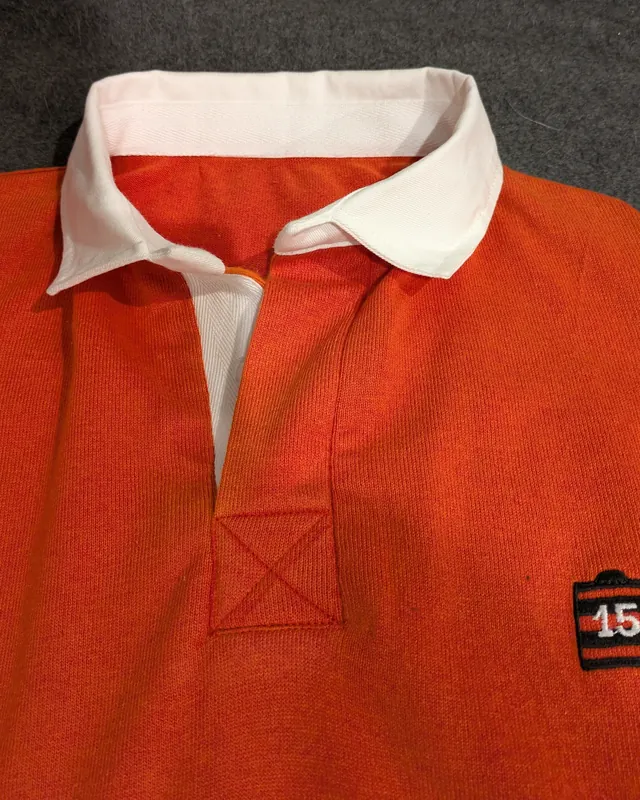An orange jumper with a new white collar