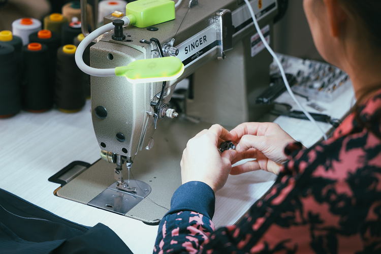 Careful garment work at a Singer sewing machine